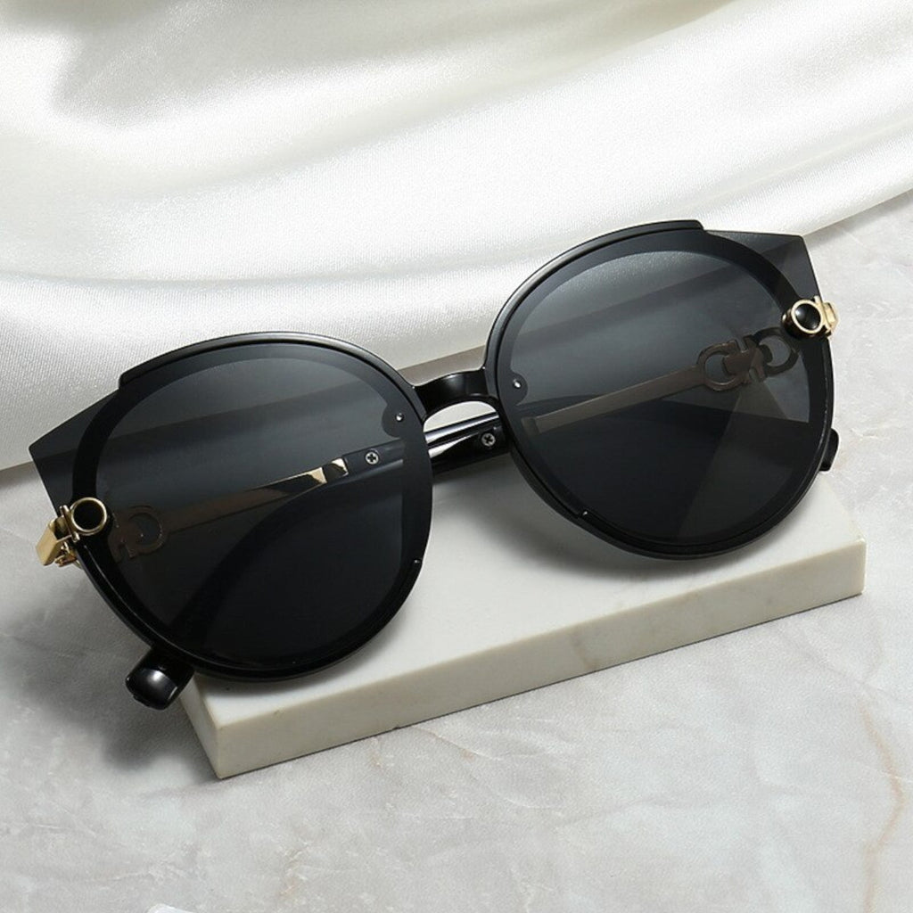 Oversized Cat-Eye-Sonnenbrille Schwarz-Gold