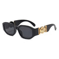 Schwarze Vintage Sonnenbrille mit goldenen Applikationen