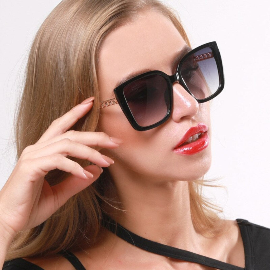 Oversized Cat-Eye-Sonnenbrille Schwarz-Gold