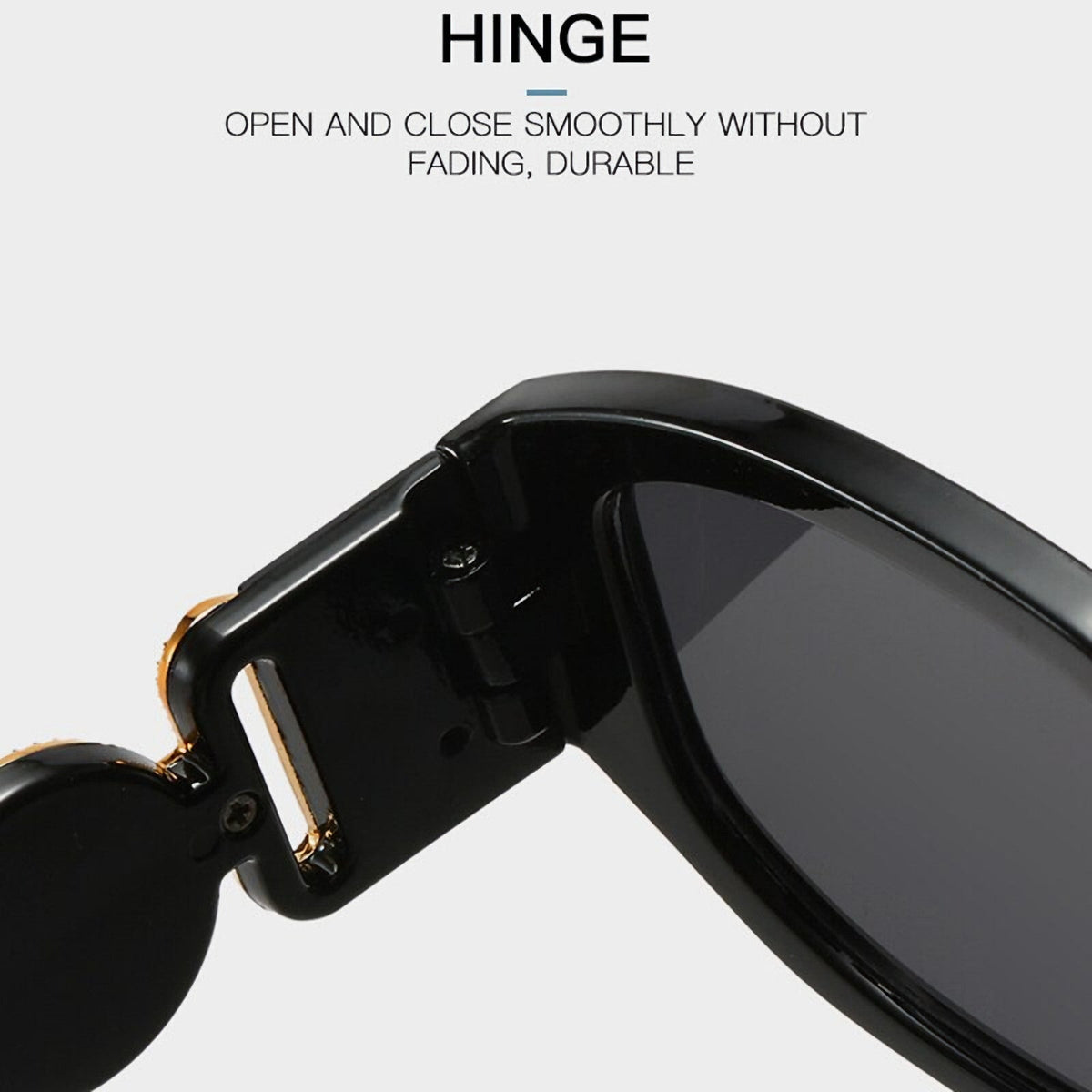 Schwarze Vintage Sonnenbrille mit goldenen Applikationen