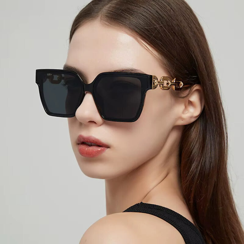 Oversized Cat-Eye-Sonnenbrille Schwarz-Gold